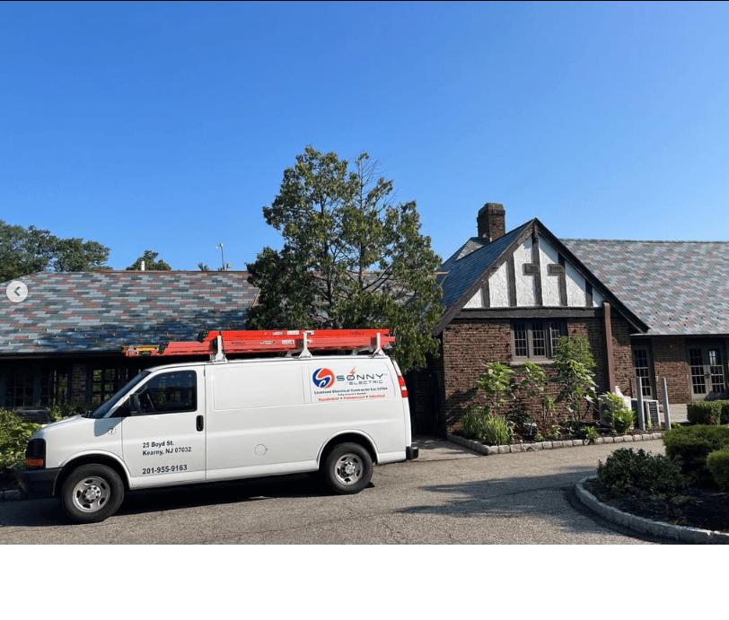Sonny Electric service truck outside a project site